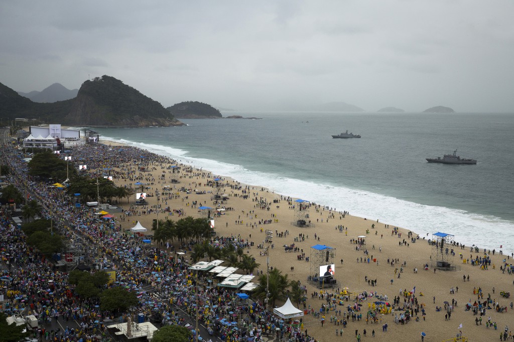 Pilgrims gather on Copacabana beach and down Atlantic Avenue prior to the arrival of Pope Francis for his World Youth Day welcoming ceremony on July 25 in Rio de Janeiro. PHOTO: CNS/Tyler Orsburn