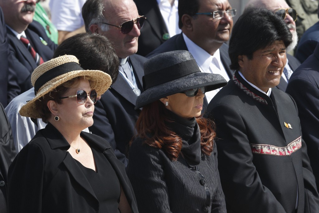 Brazil's President Dilma Rousseff, left, stands with Argentina's President Cristina Fernandez de Kirchner and Bolivia's President Evo Morales on July 28 at the closing Mass of World Youth Day celebrated by Pope Francis on Copacabana beach in Rio de Janeiro. PHOTO: CNS/Paul Haring
