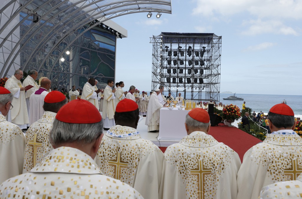 Cardinals stand beside the altar on July 28 as Pope Francis celebrates the closing Mass of World Youth Day on Copacabana beach in Rio de Janeiro.  PHOTO: CNS/Paul Haring