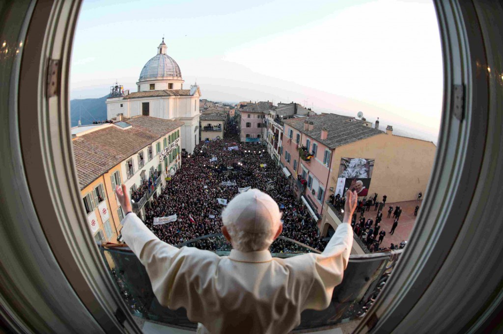 Pope Benedict XVI waves as he appears for the last time as pope on  Feb. 28 at the balcony of his summer residence in Castel Gandolfo, Italy. PHOTO: CNS/L'Osservatore Romano via Reuters