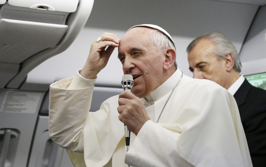 Pope Francis speaks to the media aboard the papal flight from Rio de Janeiro to Rome July 28. When the pope told reporters, "Who am I to judge" a homosexual person, he was emphasizing a part of Catholic teaching often overlooked by the media and misunderstood by many people. PHOTO: CNS/Paul Haring
