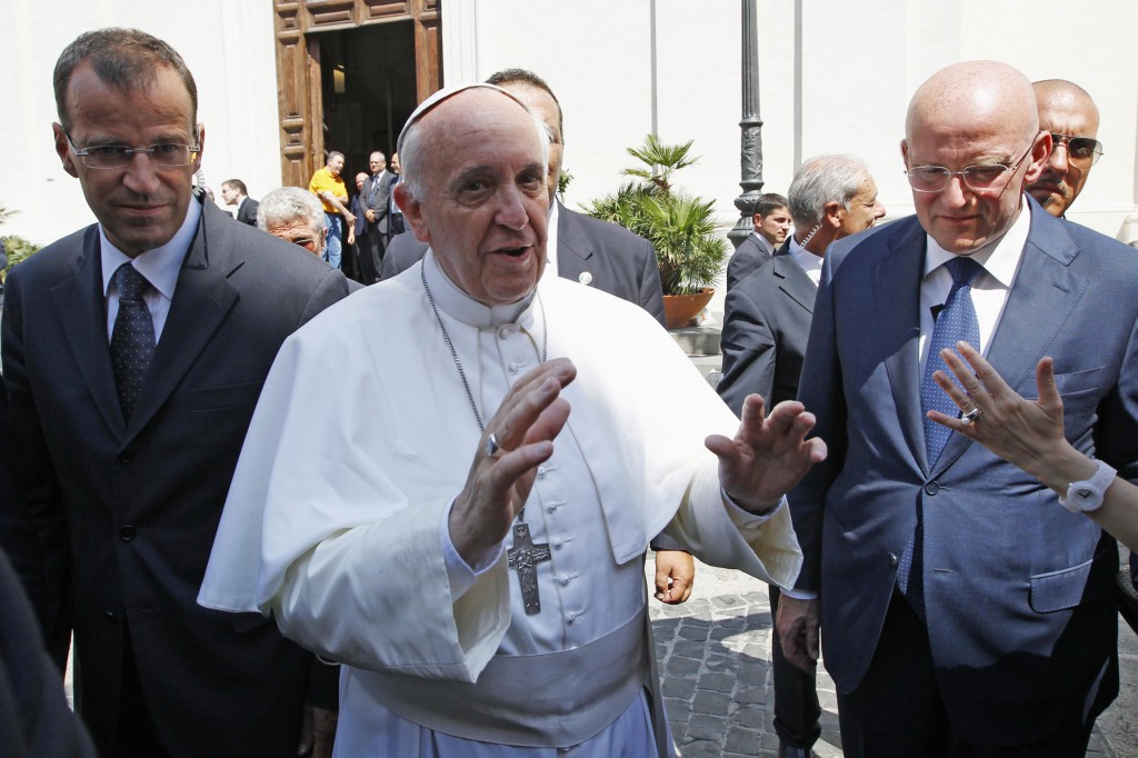 Pope Francis greets people as he leaves the papal summer residence in Castel Gandolfo, outside Rome, Aug. 15. Castel Gandolfo, a small town in the hills about 13 miles south of Rome, is where previous popes have spent the summer months. PHOTO: CNS/Giampiero Sposito, Reuters