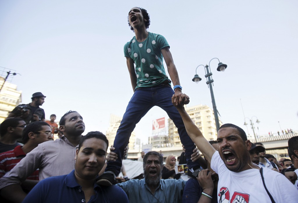 Supporters of the Muslim Brotherhood and ousted Egyptian President Mohammed Morsi shout slogans against the military and interior ministry during a protest  in front of Al Istkama mosque in Giza Square, south of Cairo. PHOTO: CNS photo/Amr Abdallah Dalsh, Reuters