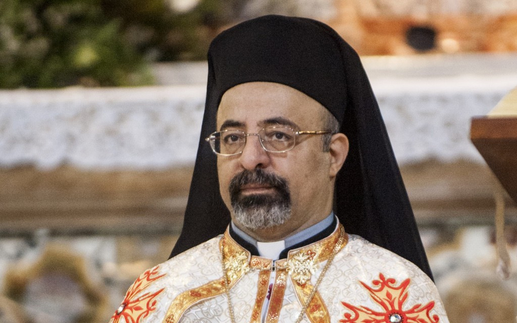 Coptic Catholic Patriarch Ibrahim Isaac Sedrak is pictured during a service at a church in Rome in this June 18 file photo. In a statement issued Aug. 18, he said the violence and unrest in Egypt are "not a political struggle between different factions, but a war against terrorism." He urged the country's Catholics to strongly support "all state institutions, particularly the armed forces and the police for all their efforts in protecting our homeland." PHOTO: CNS/Massimiliano Migliorato, Catholic Press