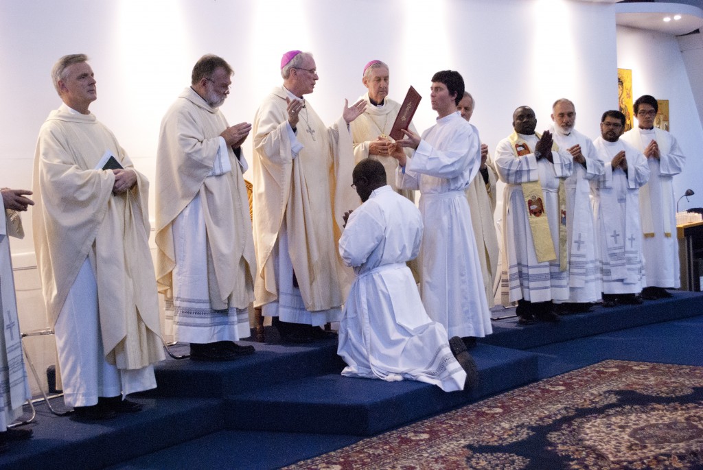 Bishop Donald Sproxton prays over Deacon Crispin Witika, moments after ordaining him to the diaconate at St Gerard Majella Church on 14 August. PHOTO: Peter Rosengren