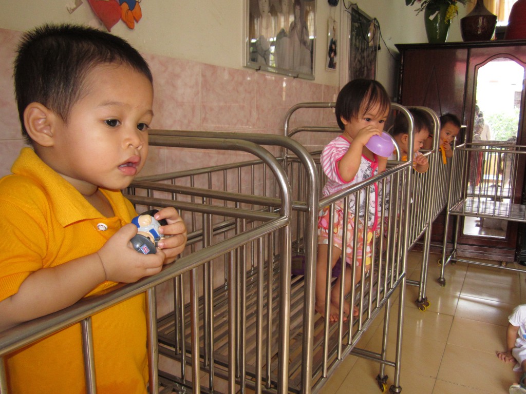 Orphaned infants, above, cared for by the Vietnamese Sisters of the Lovers of the Cross. While the Sisters care for them, they cannot afford nappies or matresses for the cots used during the day. PHOTO: Trevor and Deirdre Lyra