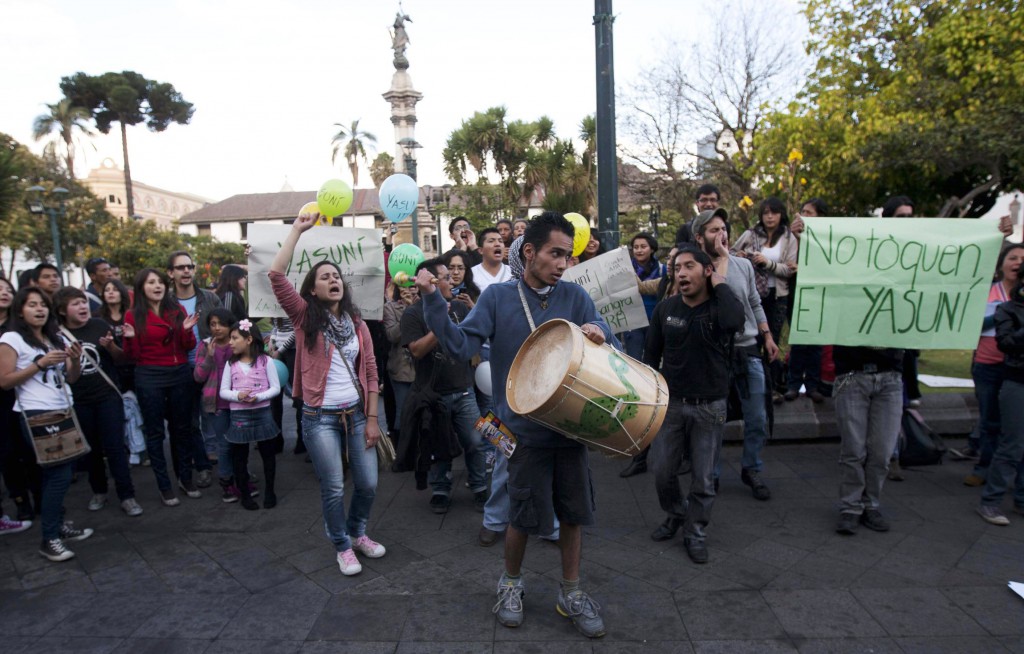Demonstrators shout slogans during a rally calling for the government to keep the Yasuni initiative in place, outside Carondelet Palace in Quito, Ecuador, Aug. 15. Ecuadorean President Rafael Correa decided in August to allow drilling in a controversial oil lease overlapping Yasuni National Park. PHOTO: CNS/Josue Leon, Reuters
