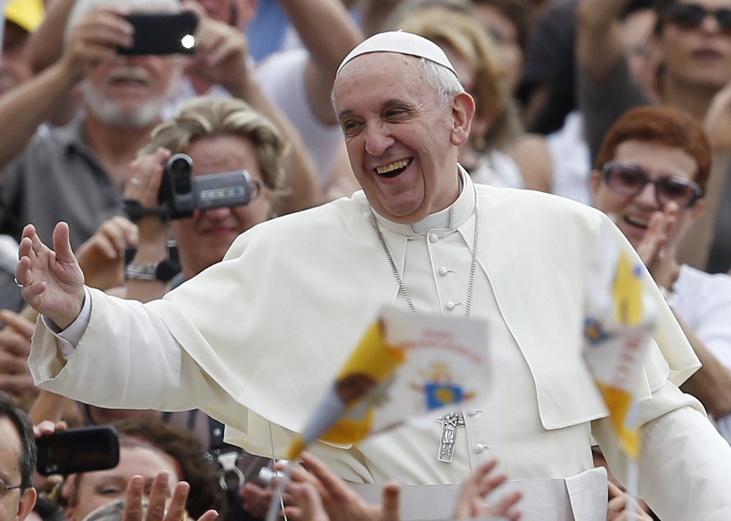 Pope Francis greets the crowd as he arrives to lead his general audience  Sept. 11 in St. Peter's Square at the Vatican. PHOTO: CNS/Paul Haring
