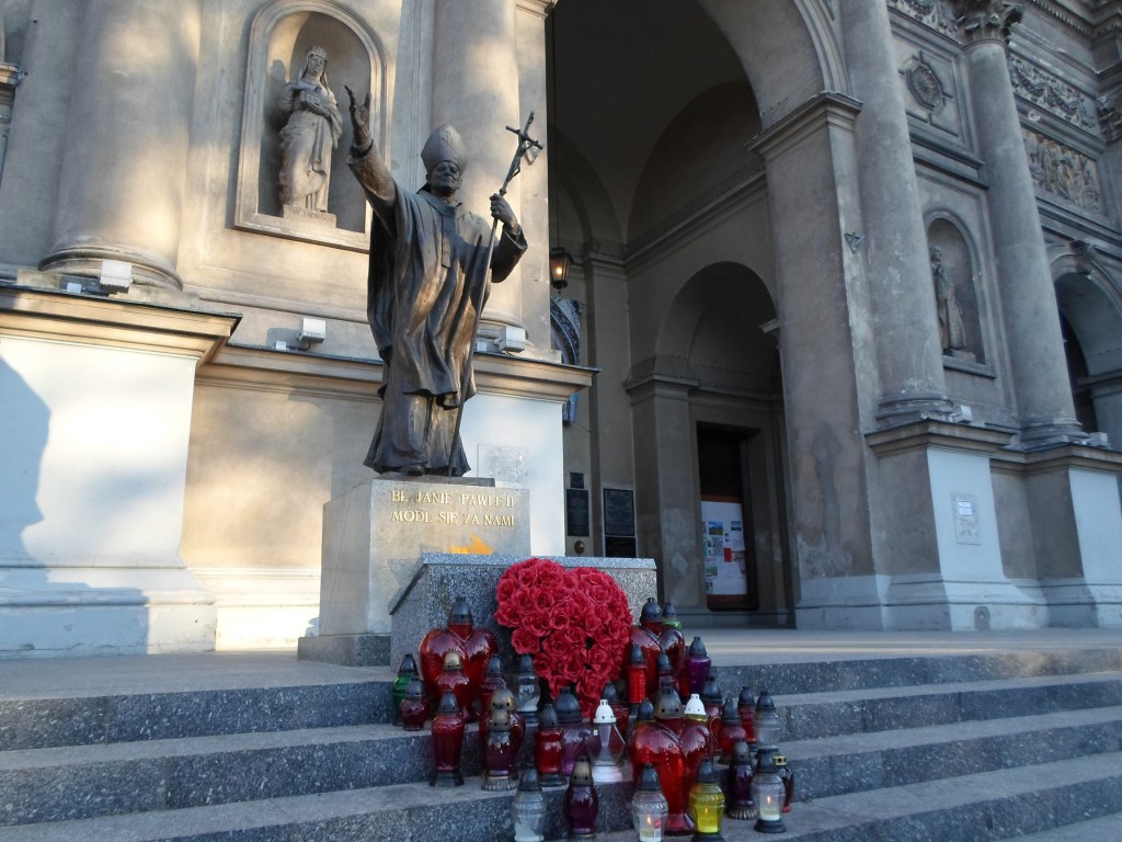 A statue of Blessed John Paul II  is seen outside All Saints Church in Warsaw, Poland, in late July. Poles welcome their native son's sainthood, saying he is a "national hero" who set an example for the faithful.  PHOTO: CNS/James Martone