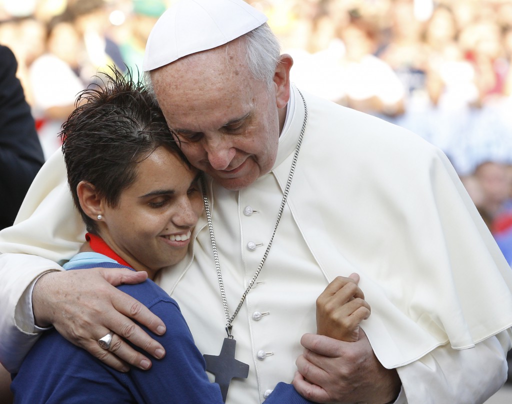 Pope Francis embraces a young woman on Sept. 22 during an encounter with youth in Cagliari, Sardinia. PHOTO: CNS/Paul Haring