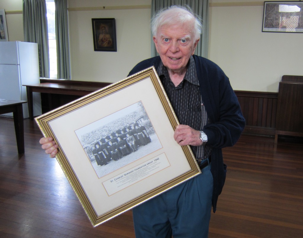 The only surviving member of St Charles’ Seminary’s first group of students, Fr Patrick Cunningham, with the 1942 class photo.