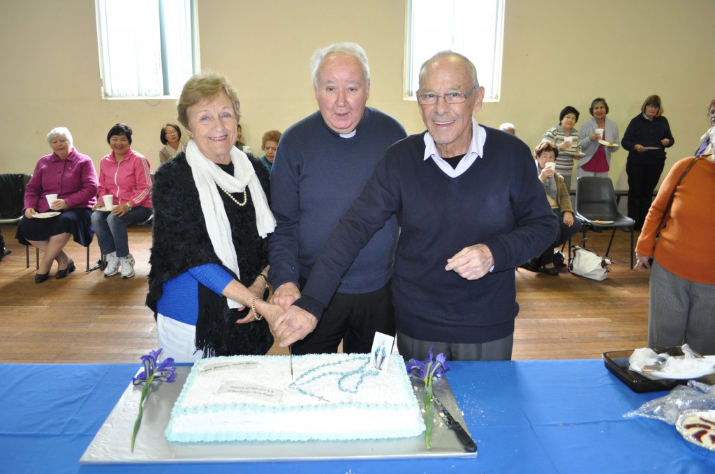 Fr Paul Carey SSC, centre, joins fellow Catholics in celebrating another successful Rosary Bouquet campaign on Our Lady’s Birthday, September 8.