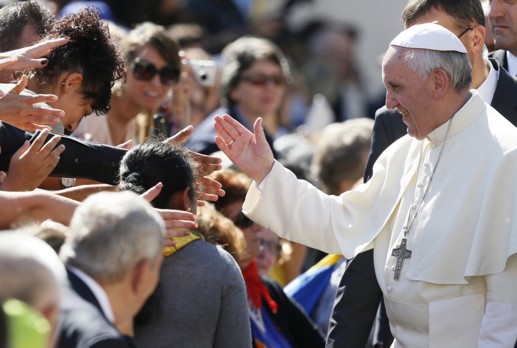 Pope Francis greets the crowd on Oct. 2 during his general audience in St. Peter's Square at the Vatican. PHOTO: CNS/Paul Haring