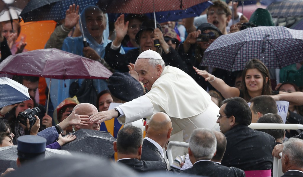 Pope Francis greets people as he arrives to lead his general audience on Oct. 9 in St. Peter's Square at the Vatican. PHOTO:  CNS/Paul Haring