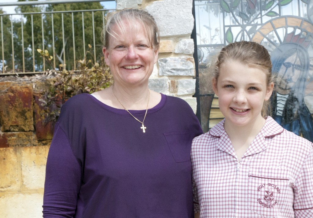 2013 June O’Connor scholarship recipient and Holy Rosary Primary Doubleview student Ann Johnston, right, with her mother Therese. The scholarship will provide $3,000 to be spent on education-related expenses for each year of Ann’s secondary education. PHOTO: Chitalu Kapambwe