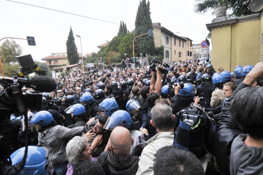 Protesters gather on Oct. 15 outside the SSPX district headquarters in Albano, south of Rome, when a hearse carrying Priebke's body arrived.