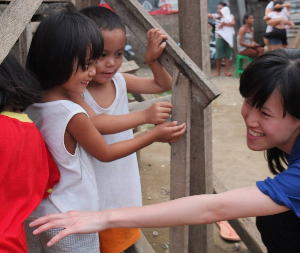 Perth Catholic Kamila Soh, right, from Buckets for Jesus during a mission to a shanty town in Cebu in the Philippines earlier this year. The group is accepting goods to take to the country in around a week’s time. PHOTO: Nicholas Scott