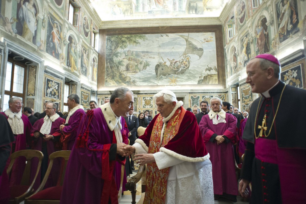 Pope Benedict XVI shakes hands with a member of the Roman Rota to mark the start of the judicial year at the Vatican Jan. 26. The Rota is a Vatican-based tribunal that deals mainly with marriage cases. Members of a marriage tribunal, including the official responsible for defending the bond of marriage, must aim to provide justice but also pastoral care to the couples involved, Pope Francis said. PHOTO: CNS/L'Osservatore Romano via Reuters