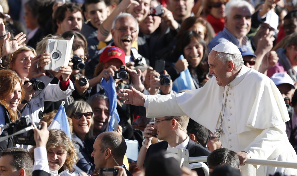 Pope Francis greets the crowd as he arrives to lead his general audience on Nov. 6 in St. Peter's Square at the Vatican. PHOTO: CNS/Paul Haring