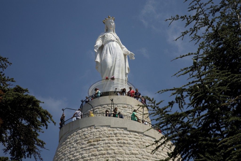 People visit the Shrine of Our Lady of Lebanon in Aug. 2012 in Harissa, east of Beirut. More than 800 Syrian and Iraqi refugees were bused to the National Shrine of Our Lady of Lebanon for a Christmas Mass. PHOTO: CNS/Dalia Khamissy