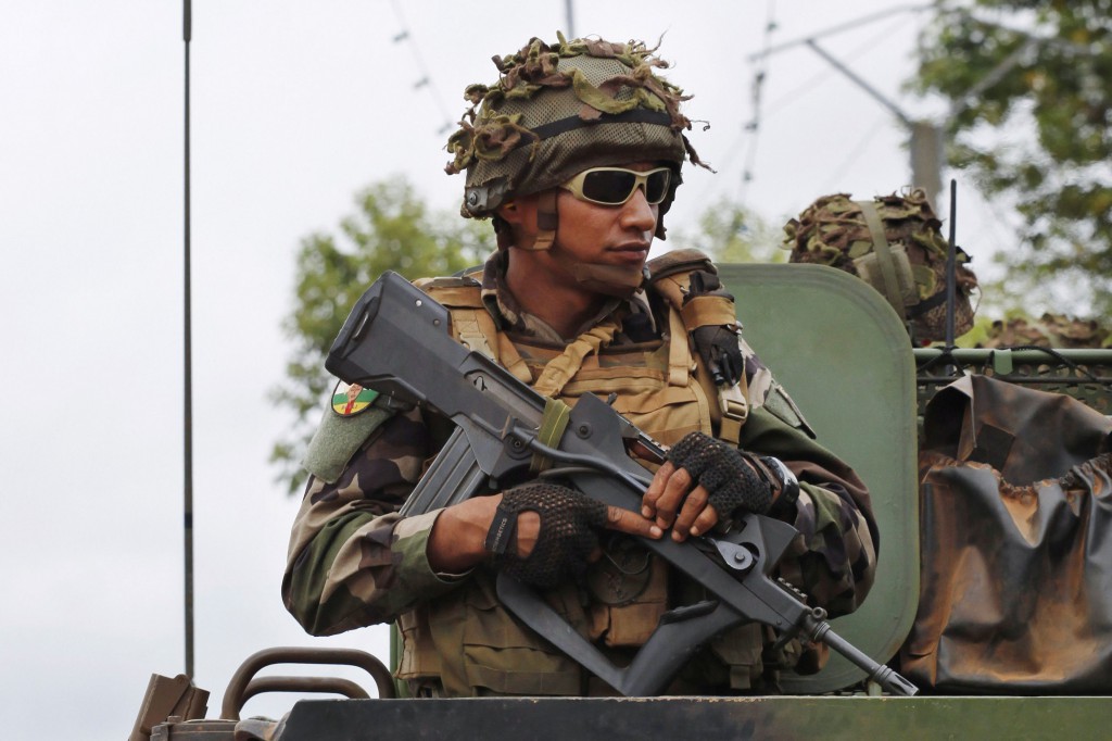 A French soldier patrols in Bangui, Central African Republic, Dec. 4. The nation's Catholic leaders welcomed the deployment of French forces amid an upsurge of fighting in the capital.  PHOTO: CNS/Emmanuel Braun, Reuters