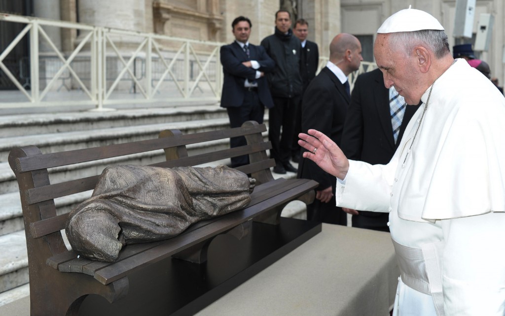 Pope Francis blesses the sculpture "Jesus the Homeless" during his general audience in St. Peter's Square at the Vatican Nov. 20. The Vatican plans to install the bronze piece by Canadian Timothy Schmalz near Vatican Radio in memory of a homeless woman who died in the cold. PHOTO: CNS/L'Osservatore Romano
