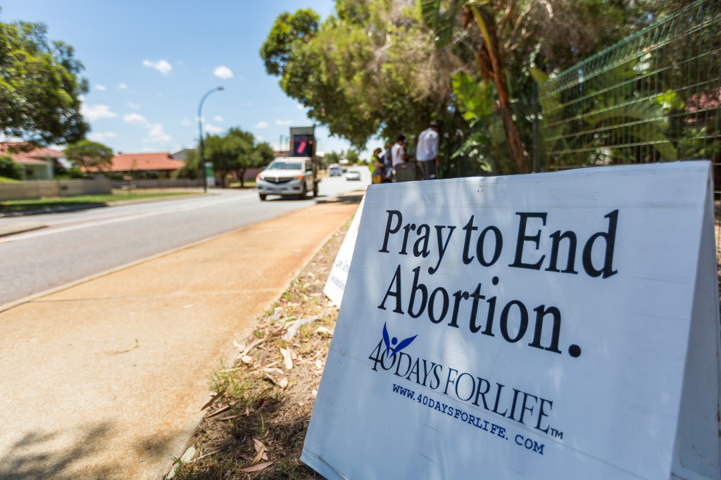 Catholics gather in prayer in front of an abortion clinic in Perth during the 40 days of life campaign in 2013.
