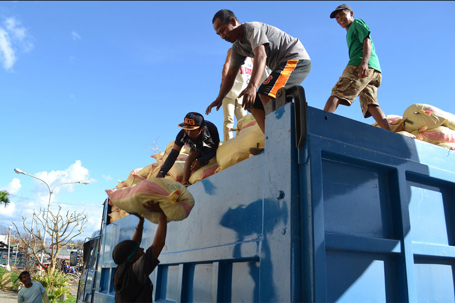 Government rice is loaded onto a truck in Ormoc pier on Leyte island. Aid is reaching the island and is being distributed to survivors of the typhoon. PHOTO: Eoghan Rice, Trócaire/Caritas