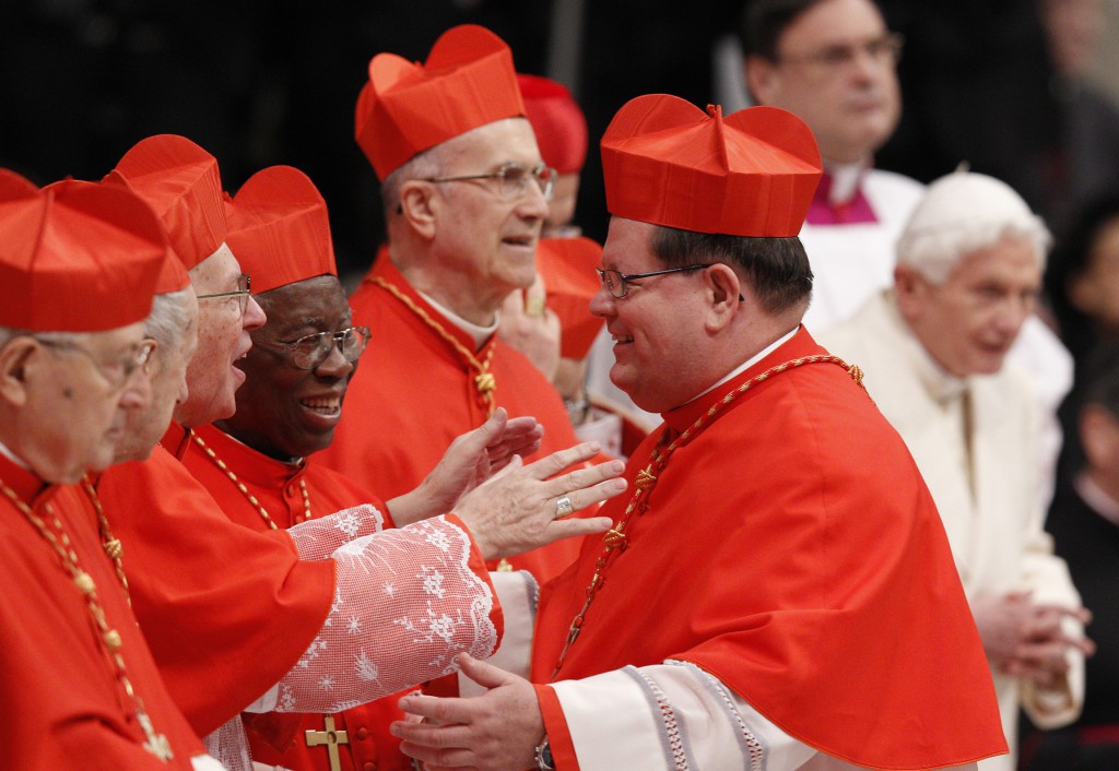 New Cardinal Gerald Lacroix of Quebec greets fellow cardinals during a consistory at which he was made a cardinal by Pope Francis in St. Peter's Basilica at the Vatican Feb. 22. Pope Francis created 19 new cardinals in the presence of Pope Benedict XVI, who made his first public appearance at a liturgy since his retirement. PHOTO: CNS/Paul Haring