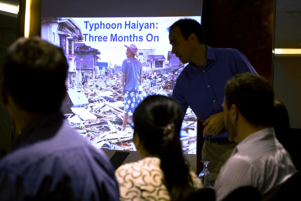 Joe Curry, country representative for Catholic Relief Services in the Philippines, gives a presentation to development agencies in Manila Feb. 3. The report was shared with representatives of CRS, Caritas Australia, Trocaire and CAFOD, all Catholic aid agencies. PHOTO: CNS/Tyler Orsburn
