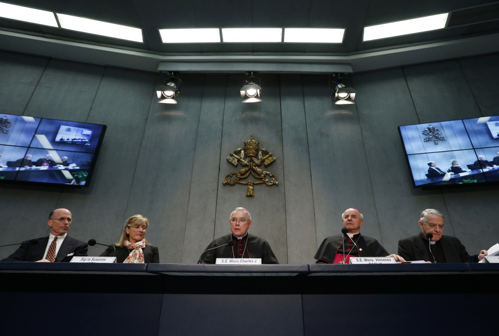 Archbishop Charles J. Chaput of Philadelphia, center, speaks during a press conference with a delegation from Pennsylvania at the Vatican March 25. Also pictured from left are Eustace and Susanne Mita, Archbishop Vincenzo Paglia, president of the Pontifical Council for the Family, and Jesuit Father Federico Lombardi, the Vatican spokesman. PHOTO: CNS/Paul Haring