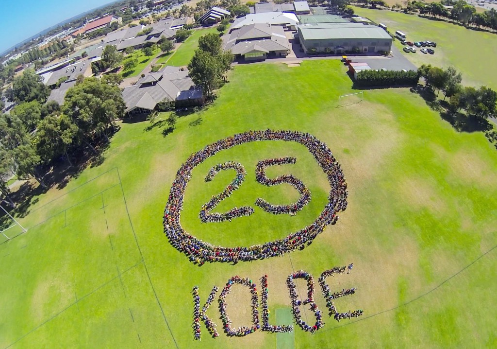 A bird's eye view of the Kolbe Oval where students and staff form a "25" and the word "Kolbe" in commemorating the College's 25th Anniversary. PHOTO: Kolbe College