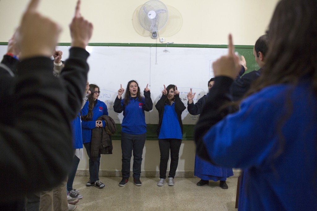 Students pray in the classroom of St. George School in the Zalka section of Beirut on March 14 after distributing aid during the first Youth of Life visit. PHOTO: CNS/Dalia Khamissy
