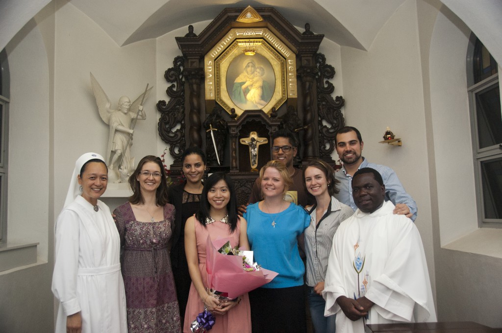 Adeline Bock Tuang Wern with flowers of congratulations, flanked by her friends and well-wishers, including Schoenstatt Sr Rebecca Sampang and Fr Kenneth Asaba, parish priest of St Brigid’s in Midland. PHOTO: Jun Suarez