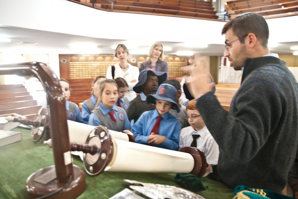 Rabbi Nathanael explains the importance of the Torah scrolls to children from St Paul’s Parish during their visit on May 13. PHOTO: Matthew Biddle