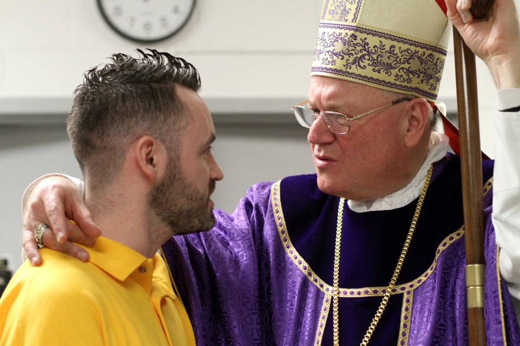 Cardinal Timothy M. Dolan of New York speaks with inmate Gary McGurk after celebrating Mass April 14 for inmates and staff at Sullivan Correctional Facility, a New York state maximum-security prison in Fallsburg, N.Y. PHOTO: CNS/Gregory A. Shemitz