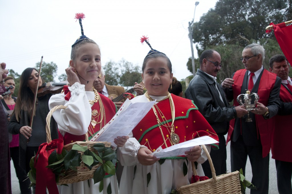 Two girls in traditional dress from Madeira sang devotional hymns to the Holy Spirit.  