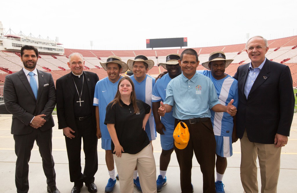Los Angeles Archbishop Jose H. Gomez, second from left, and Supreme Knight Carl Anderson of the Knights of Columbus, far right, pose July 14 at the Los Angeles Memorial Coliseum with leaders and athletes of the 2015 Special Olympics World Games, scheduled next summer in Los Angeles. The Knights of Columbus has pledged $1.4 million to help cover costs for the games. PHOTO: CNS/Victor Aleman, Vida-Nueva.com