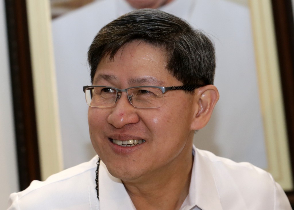 Philippine Cardinal Luis Antonio Tagle speaks during a press conference in Manila July 29. Cardinal Tagle announced that the pope will visit the Philippines January 15-19 and is likely to visit victims of Typhoon Haiyan. PHOTO: CNS/Francis R. Malasig, EPA