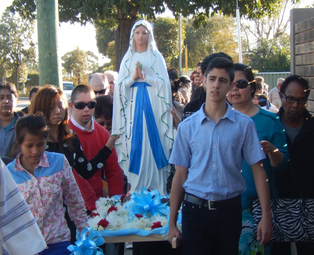 Parishioners carry the statue of Our Lady to the new grotto at St Gerard Majella parish was opened on August 3.