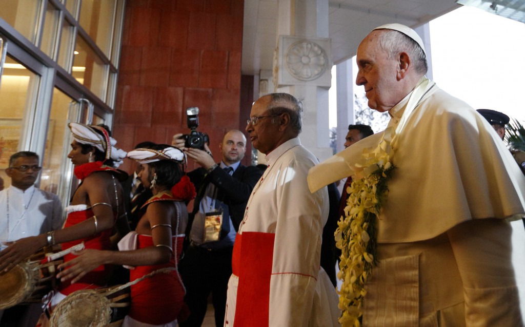 Pope Francis and Cardinal Albert Malcolm Ranjith of Colombo, Sri Lanka, arrive for a meeting with religious leaders at the Bandaranaike Memorial International Conference Hall in Colombo, Sri Lanka, on 13 January. PHOTO: CNS/Paul Haring