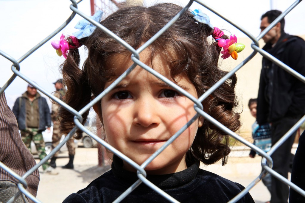 A displaced Syrian girl finds temporary shelter at a school in Damascus, Syria, Feb. 23. Forces of ISIS have attacked Christian Assyrian villages in north-eastern Syria, in the region of Khabour in the Hassake governorate. PHOTO: CNS/Youssef Badawi, EPA