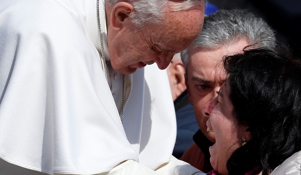 A woman in a wheelchair cries as she meets Pope Francis during his general audience in St Peter's Square at the Vatican this week. PHOTO: CNS