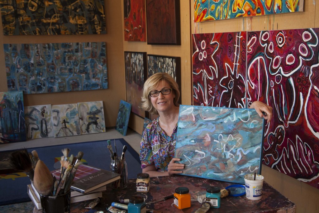 Tracy Knowles-Shelly at home in her studio with one of pieces of art that was on display at the Easter Art Exhibition. PHOTO: Jamie O'Brien
