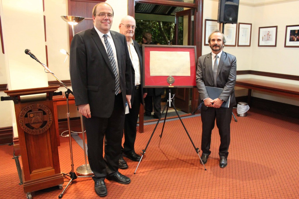 The Honourable Justice Robert Mitchell, Terry Merchant and Professor Doug Hodgson during the donation of the replica Magna Carta at the Eminent Speakers Series.  PHOTO: Supplied