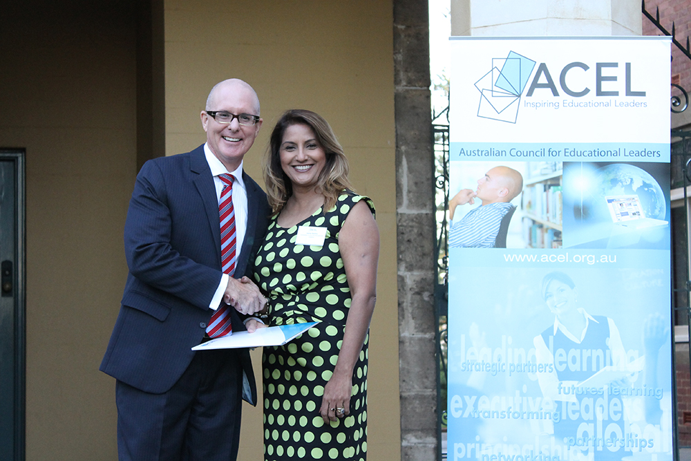 Dr Shane Glasson receives the ACEL Award from Aasha Murphy, Chief Executive Officer of the Australian Council for Educational Leaders. PHOTO: ACEL