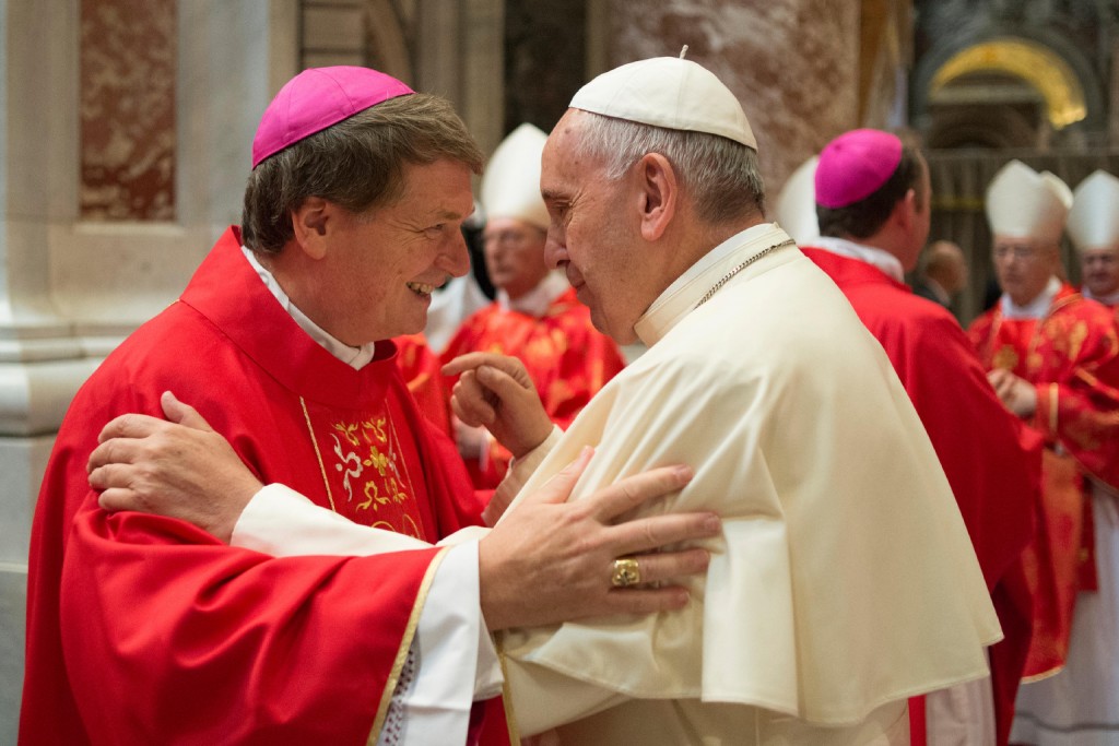 Pope Francis greets Archbishop Anthony Fisher of Sydney after a Mass marking the feast of Sts. Peter and Paul in St. Peter's Basilica at the Vatican June 29. In a departure from a 32-year tradition, the pope did not confer palliums on the 46 new archbishops in attendance. The actual imposition of the pallium will take place in the archbishop's archdiocese. PHOTO: CNS/Paul Haring