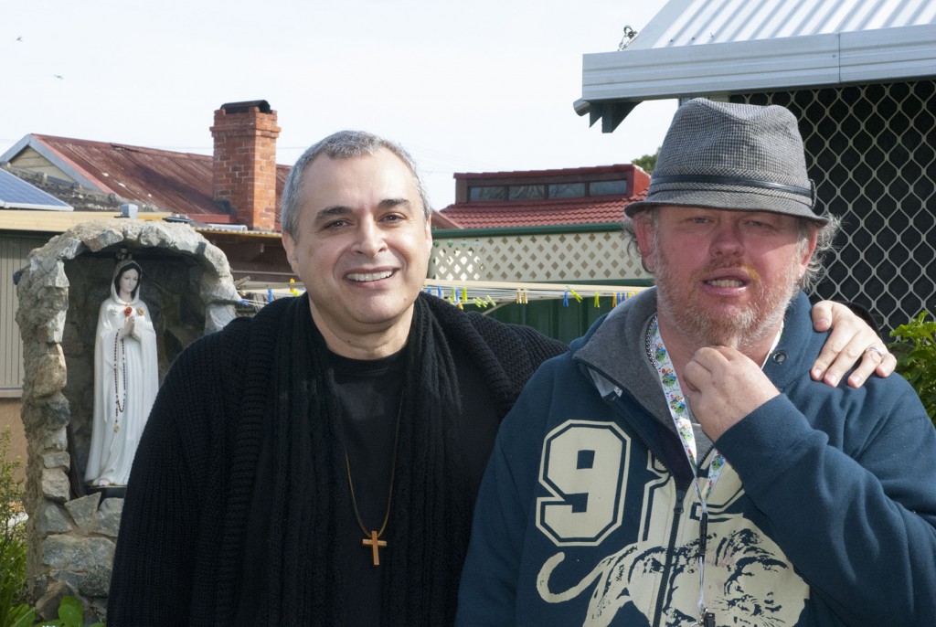 Br Alan and long-term resident at the Emmaus Community, Michael Smith, stand beside the grotto to the Virgin Mary in one of the many gardens at the Emmaus Community, Queens Park. PHOTO: Marco Ceccarelli