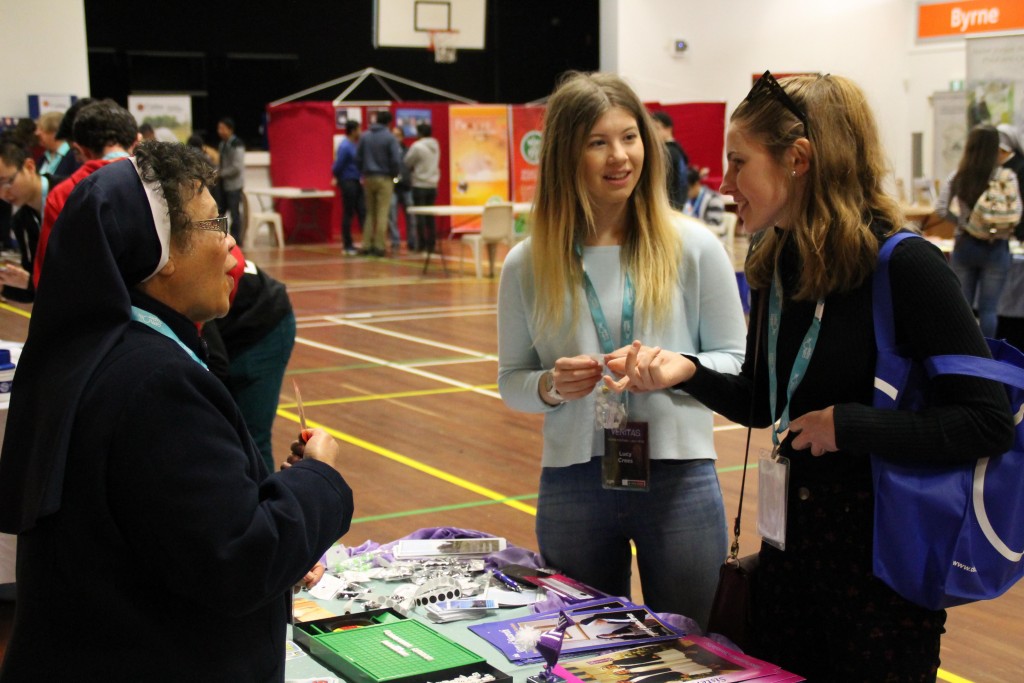 The Sisters of Nazareth, pictured with Lucy Crees and Anna Watt, were one of more than 20 groups and agencies that hosted stalls at the Veritas Youth Festival. PHOTO: CYM