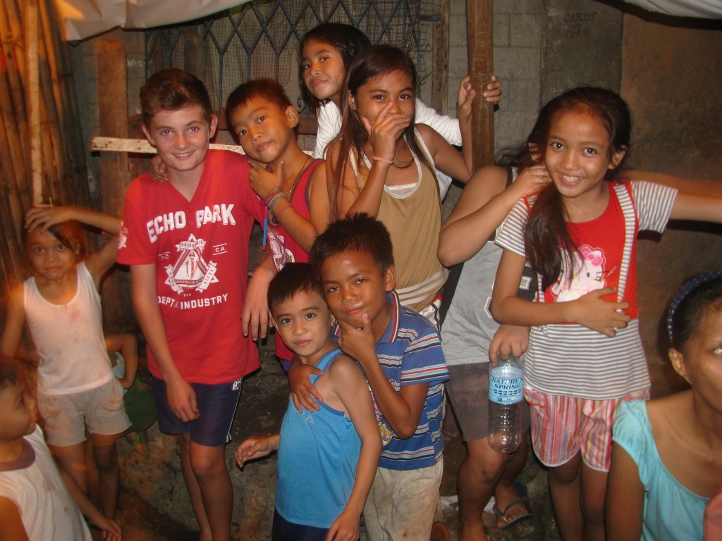 In July this year, eRecord journalist Mark Reidy took his 13-year-old son Joseph (second from left) on a mission trip to the Philippines to spend time with the Holy Spirit of Freedom (HSOF) Community. PHOTO: Mark Reidy
